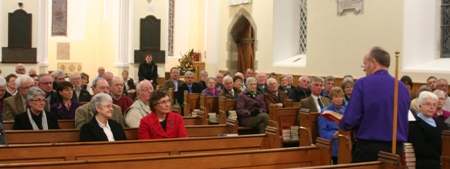 The crowd in Drummaul Parish Church listen attentively to Bishop Alan.